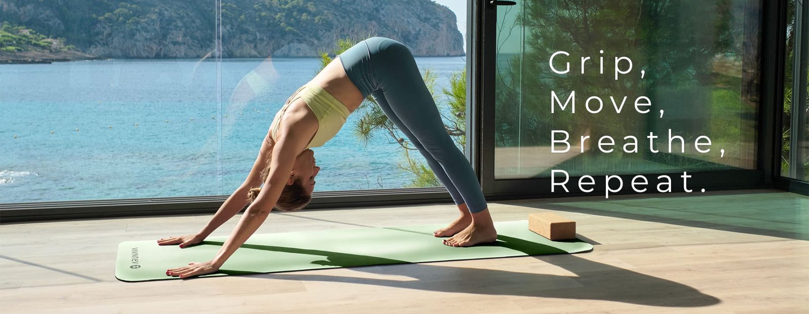 Relaxed woman doing yoga in Downward Facing Dog pose
